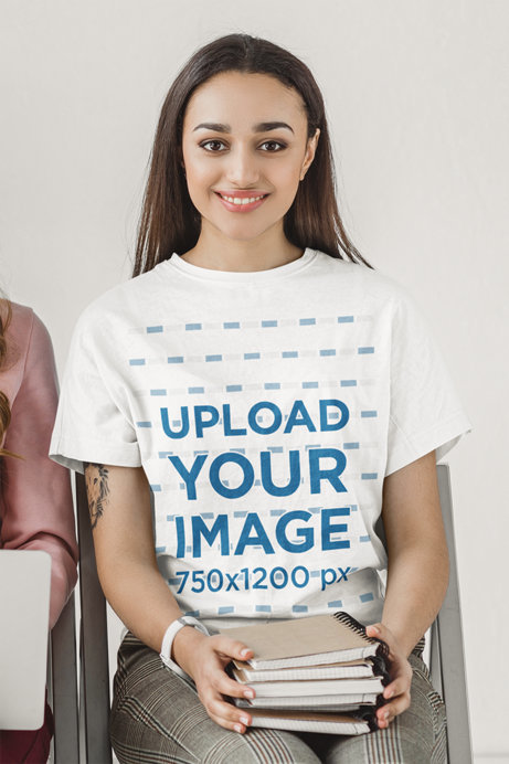 T-Shirt Mockup of a Woman with Books on Her Lap