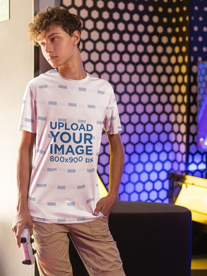 Sublimated Jersey Mockup of a Young Gamer Leaning on a Wall 