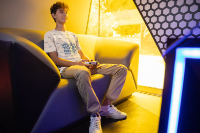 Jersey Mockup Featuring a Happy Young Man Playing Video Games 