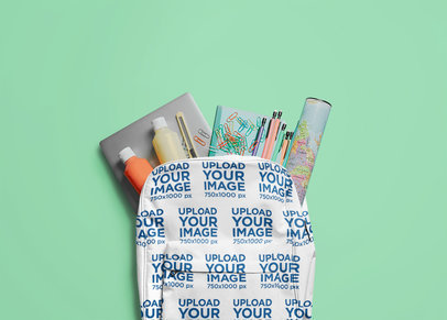 Mockup of a Backpack With School Supplies Inside