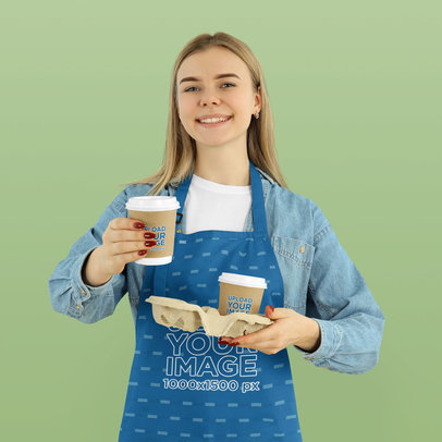 Sublimated Apron Mockup of a Woman Holding Paper Cups