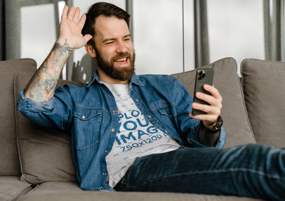 T-Shirt Mockup of a Bearded Man Making a Video Call