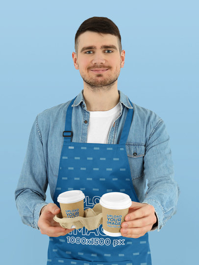 Apron Mockup Featuring a Happy Man Holding Two Paper Cups