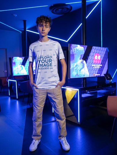 Jersey Mockup of a Young Man Posing at a Gamer's Arena