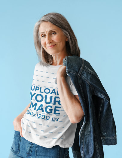 T-Shirt Mockup of an Elderly Woman with a Jacket over Her Shoulder