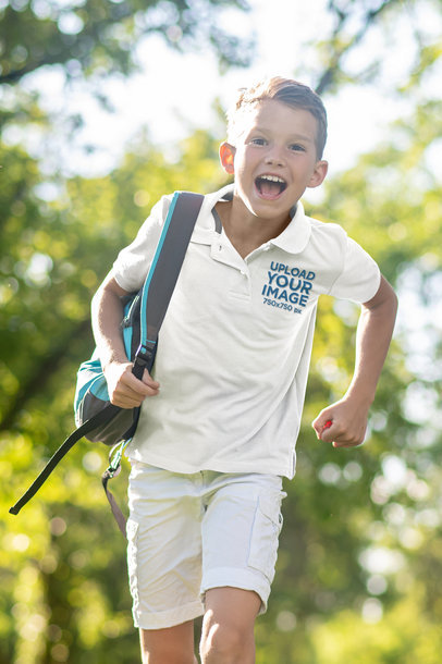 Polo Shirt Mockup Featuring an Excited Boy Running With a Backpack