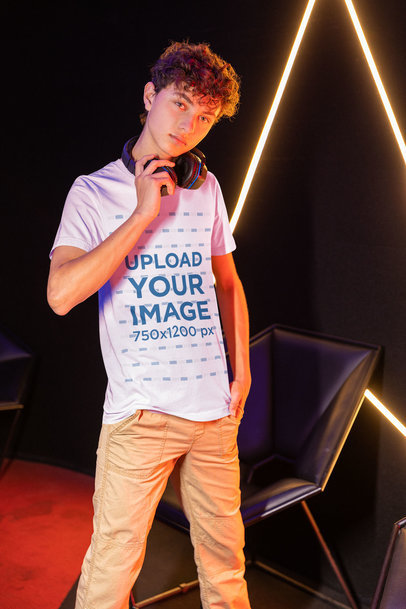 Gaming Mockup Featuring a Man Wearing a Tee at a Gamers' Arena