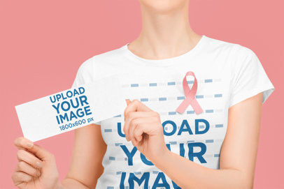 Breast Cancer Awareness-Themed T-Shirt Mockup of a Woman Holding a Flyer