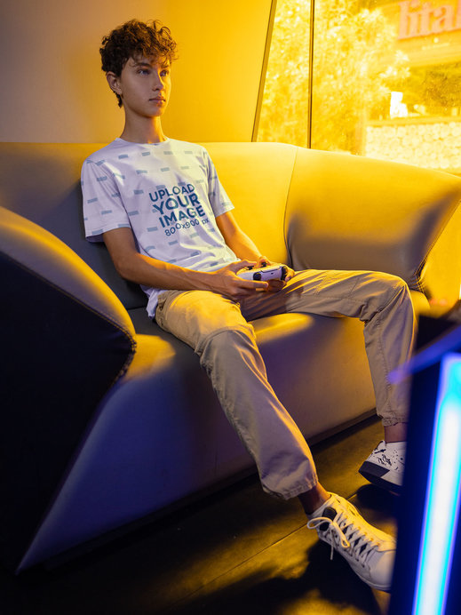 Mockup of a Man Playing Video Games While Wearing a Jersey