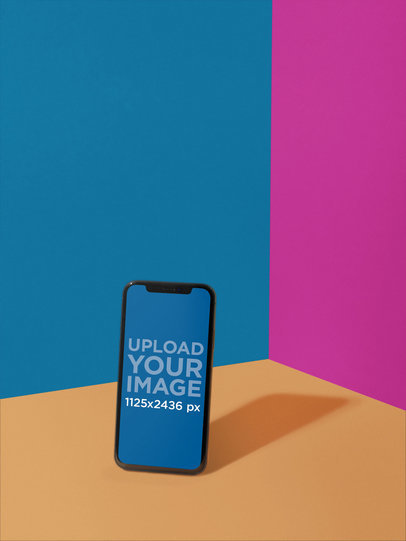 iPhone X Mockup Standing on a Three-Colors Room a19720
