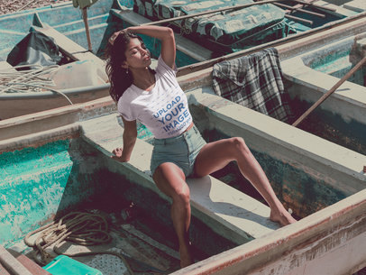 Woman Posing Wearing a Tshirt Mockup in a Small Boat