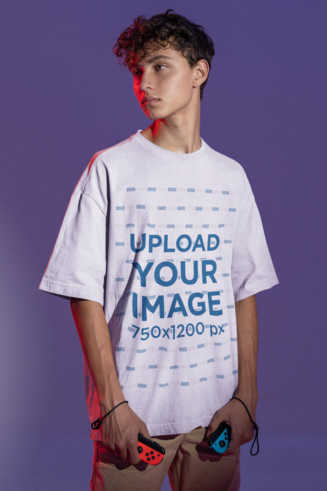 Tee Mockup of a Man Holding Two Video Game Controllers