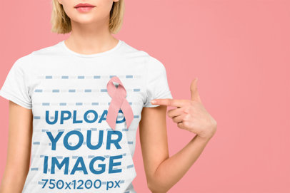 T-Shirt Mockup of a Woman Pointing at Her Cancer Awareness-Supportive Ribbon