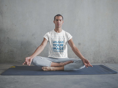 Man Wearing a T-Shirt Mockup Meditating in Lotus Position
