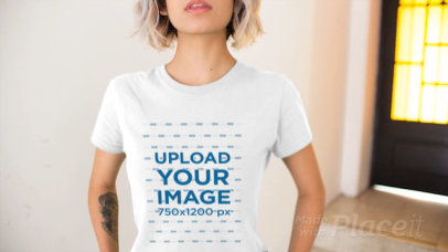 Trendy Woman Wearing a T-Shirt Video Near a Window and Yellow Door