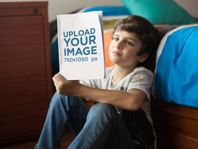 Little Kid Reading a Book Mockup by his Bed