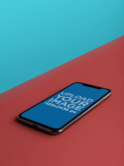 iPhone 11 Pro Mockup Lying on a Bicolor Surface