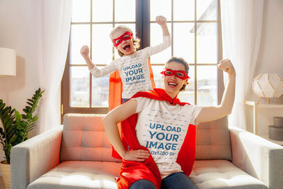 T-Shirt and Long Sleeve Tee Mockup Featuring a Mom and a Daughter With Superhero Costumes