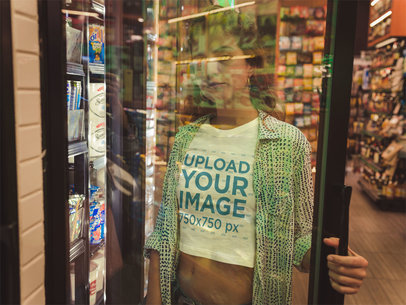 Blonde Woman Wearing a T-Shirt Mockup on the Other Side of the Window