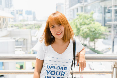 V-Neck Tee Mockup Featuring a Woman Posing on a Balcony m17242 r-el2