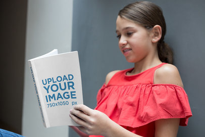 Girl Reading a Book Mockup Against a Wall