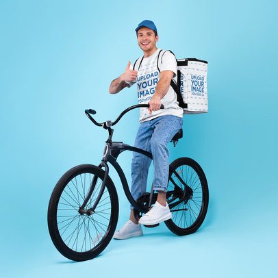 T-Shirt Mockup of a Man with a Delivery Backpack Riding a Bike