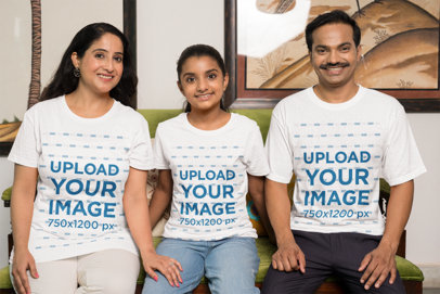 T-Shirt Mockup of a Happy Family Posing at Home