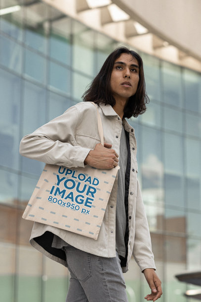 Mockup of a Man with Long Hair Carrying a Tote Bag