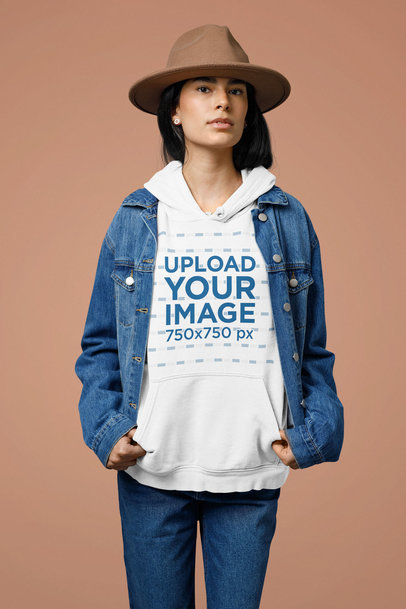 Mockup of a Woman Wearing a Pullover Hoodie Under a Denim Jacket