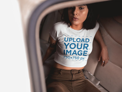 Woman Wearing a Crop Top T-Shirt Mockup in the Back Seat of a Car