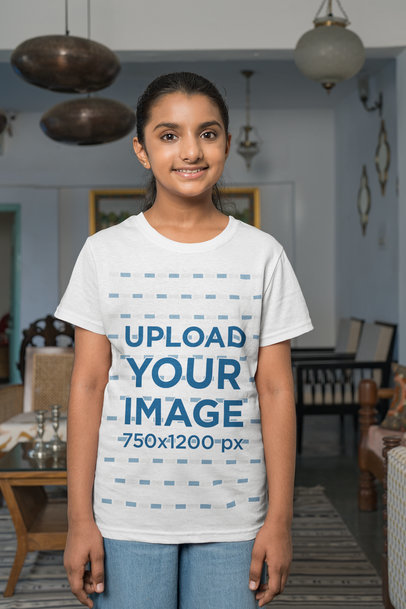 Mockup of a Happy Girl Wearing a Round-Neck Tee at Home