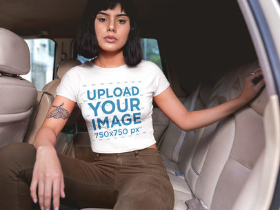 Woman Wearing a Crop Top Mockup in the Back Seat of a Car