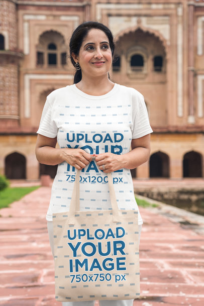 Tee Mockup Featuring a Woman Holding a Tote Bag in Front of Her