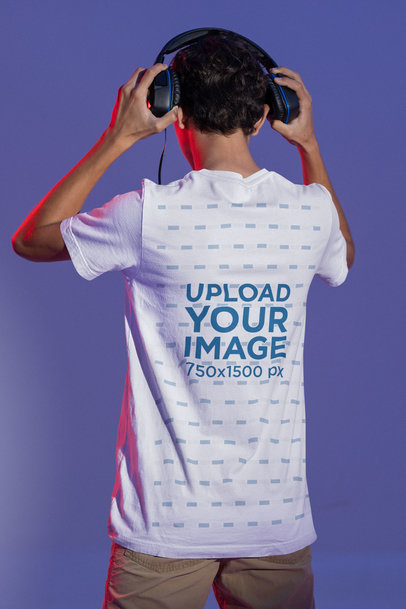 Back-View Bella Canvas T-Shirt Mockup of a Man Putting On Headphones at a Studio