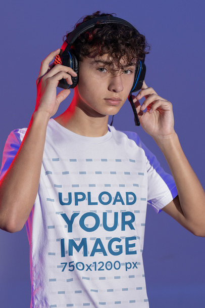 Tee Mockup Featuring a Teen Gamer Wearing Headphones