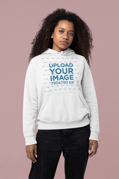 Mockup of a Serious Woman Wearing a Pullover Hoodie at a Studio
