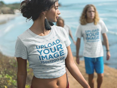 Woman Walking with her Friends Wearing T-Shirts Mockup at the Beach