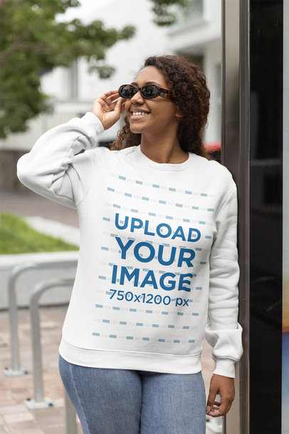 Sweatshirt Mockup of a Happy Woman Hanging Out in the City 