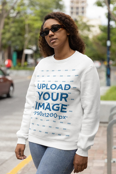 Sweatshirt Mockup Featuring a Woman with Curly Hair Wearing Retro Sunglasses