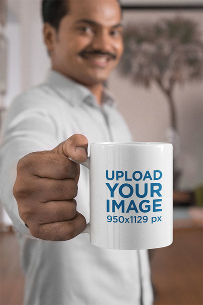 Mockup of a Man With a Mustache Holding a Mug at Home