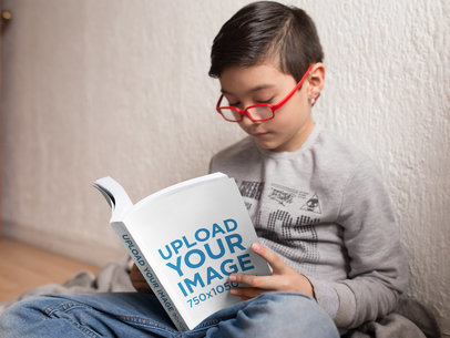 Little Boy Reading a Book Mockup with His Glasses On a19148