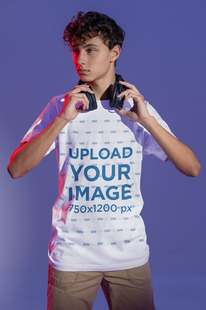 T-Shirt Mockup of a Serious Gamer About to Put on Some Headphones