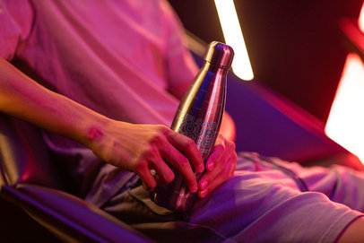 Mockup of a Teen Holding an Aluminum Bottle 