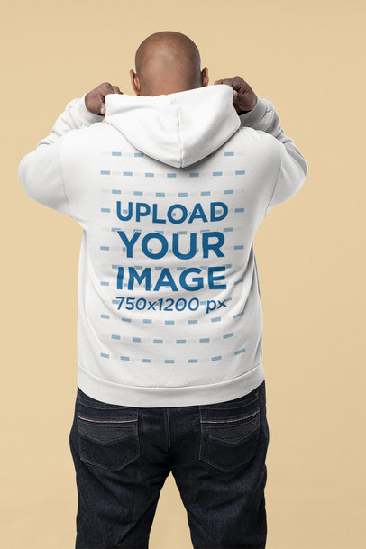 Back-View Hoodie Mockup Featuring a Man Putting His Hood Up