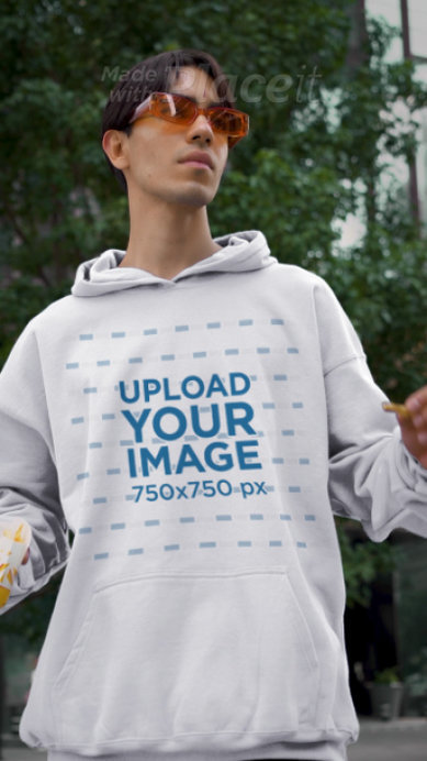 Pullover Hoodie Video Featuring a Man Eating French Fries