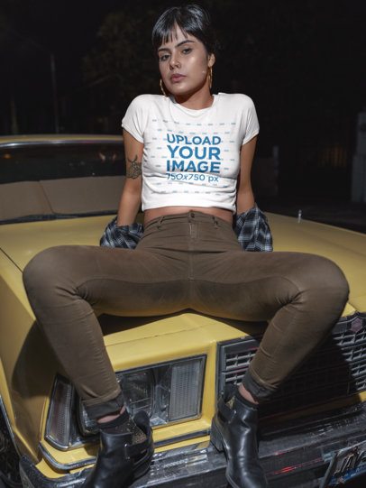 Latin Woman Wearing a Tshirt Mockup Sitting on the Hood of a Car