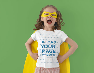 T-Shirt Mockup of a Little Girl Posing in a Super Hero Costume