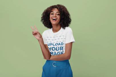 Heathered T-Shirt Mockup Featuring a Happy Woman Doing the Peace Sign