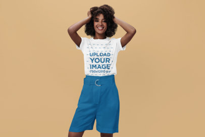 Heathered Tee Mockup of a Woman with Curly Hair Posing in a Studio