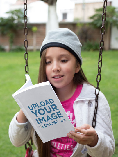 Little Happy Girl Reading her Book Mockup on a Swing